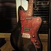Squier by Fender, Jagmaster electric guitar. Black body, rosewood neck